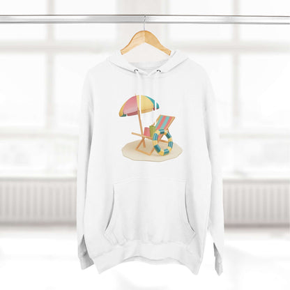 White hoodie featuring a vibrant beach chair and umbrella design, perfect for a relaxed, sunny day look.