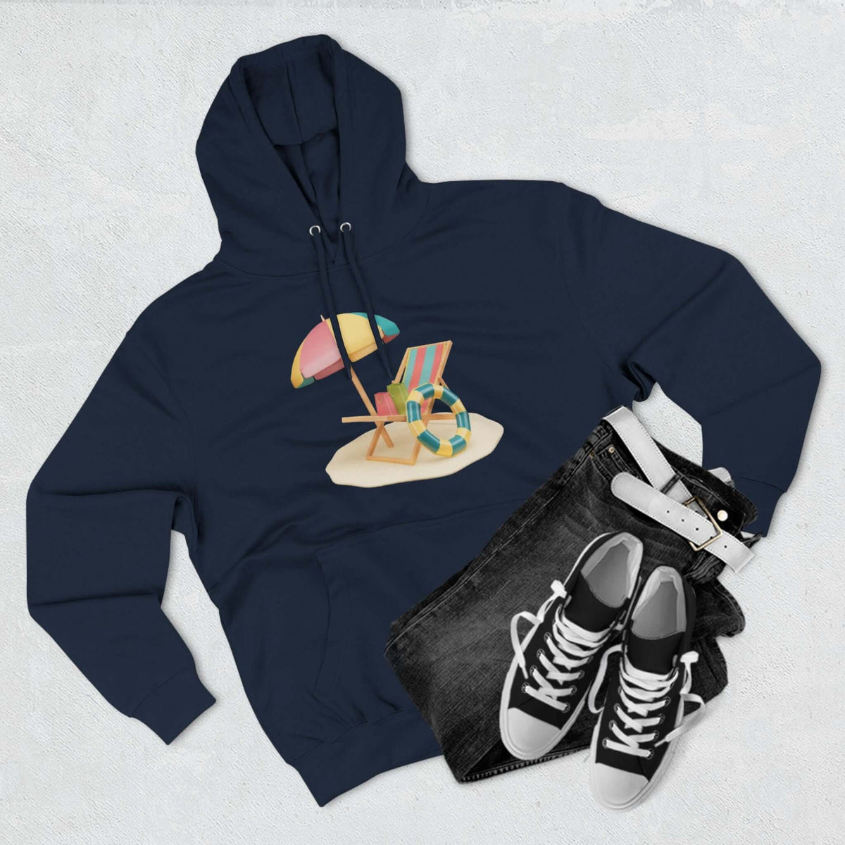 Navy Sunny Resort Hoodie with beach chair and umbrella design, styled with jeans and sneakers, perfect for casual outings.