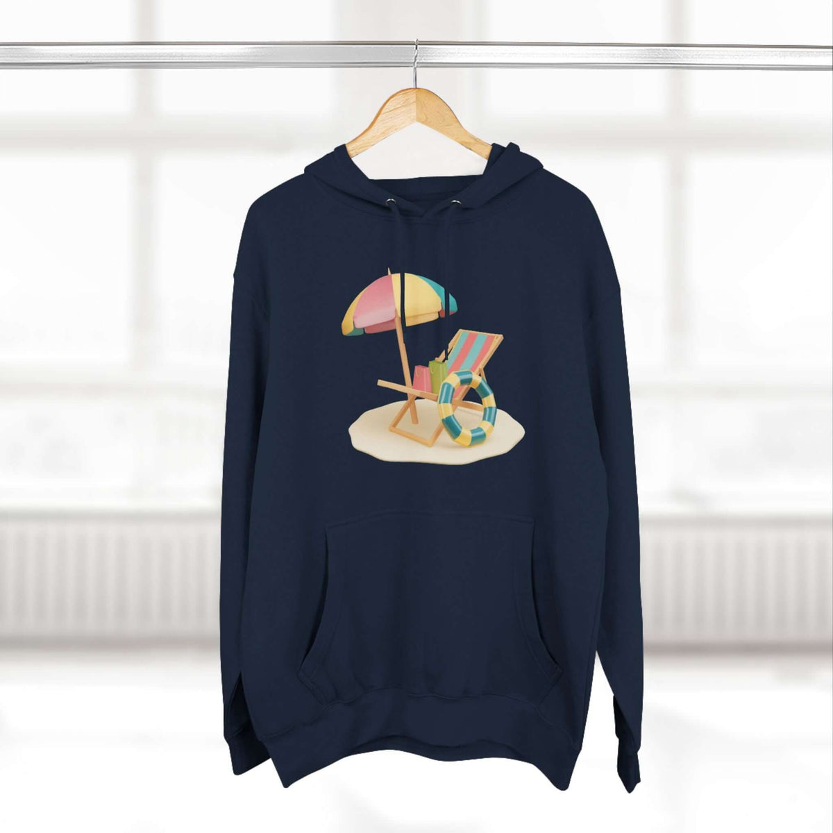 Navy hoodie featuring a playful beach scene with an umbrella and deck chair, perfect for cozy summer vibes.