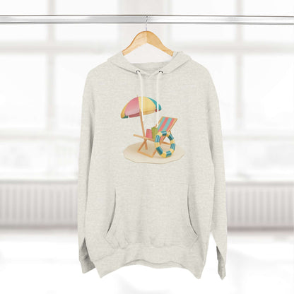 Sunny Resort Hoodie featuring a beach scene graphic with an umbrella and chair, perfect for a relaxed, stylish look.