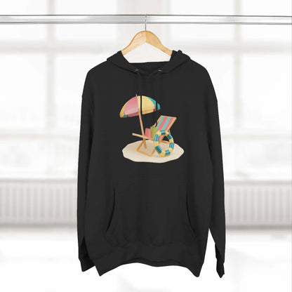 Black hoodie featuring a vibrant beach scene with an umbrella and lounge chair, perfect for a relaxed, stylish look.