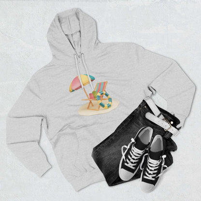 Gray Sunny Resort Hoodie displayed with beach chair graphic, paired with black jeans and sneakers.