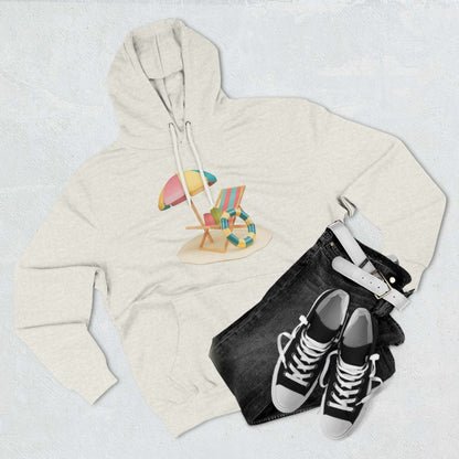 Cozy Sunny Resort Hoodie with beach chair design, paired with black jeans and sneakers on a textured background.