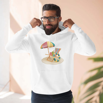 Man wearing a white Sunny Resort Hoodie featuring a beach chair and umbrella design, perfect for a relaxed, stylish look.