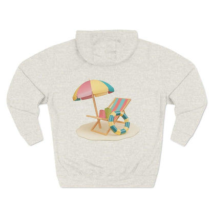 Back view of the Sunny Resort Hoodie featuring a beach chair, umbrella, and lifebuoy design on a light background.