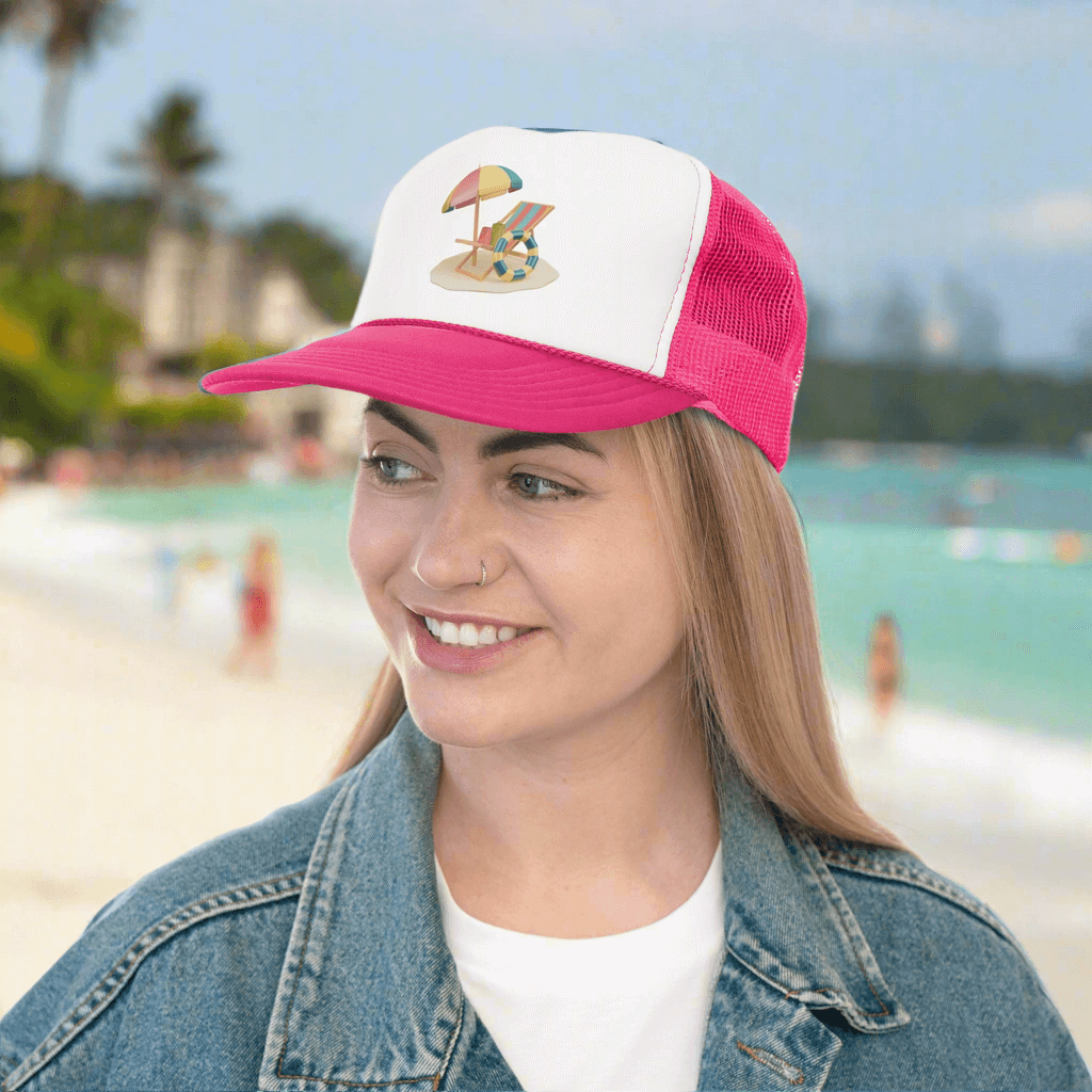Woman wearing RC'nSONS Sunny Resort Trucker Cap with beach graphic, vibrant style, in tropical setting.