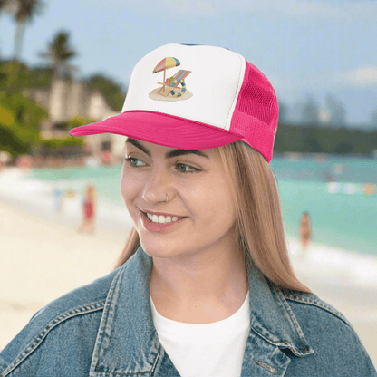 Woman wearing RC'nSONS Sunny Resort Trucker Cap with beach graphic, vibrant style, in tropical setting.
